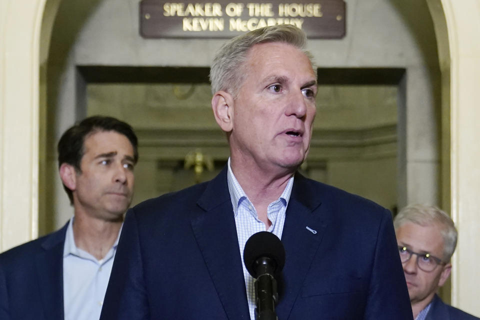 House Speaker Kevin McCarthy of Calif., speaks during a news conference after President Joe Biden and McCarthy reached an "agreement in principle" to resolve the looming debt crisis on Saturday, May 27, 2023, on Capitol Hill in Washington. Rep. Patrick McHenry, R-N.C., back right, and Rep. Garret Graves, R-La., left, listen. (AP Photo/Patrick Semansky)