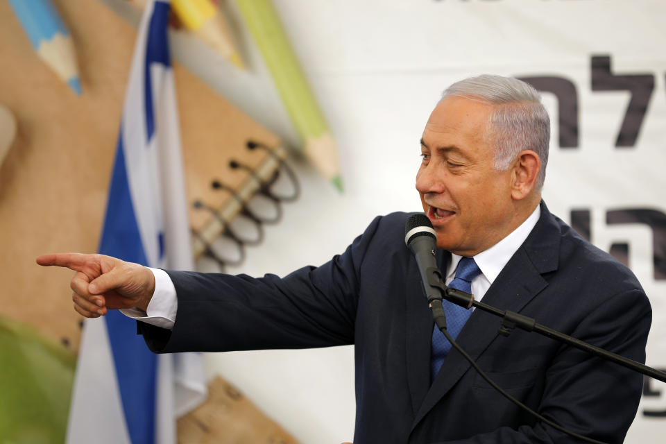 Israeli Prime Minister Benjamin Netanyahu gestures as he speaks during a ceremony opening the school year in the settlement of Elkana Sunday, Sept. 1, 2019. Netanyahu is reaffirming his pledge to impose Israeli sovereignty on West Bank settlements. (Amir Cohen/Pool Photo via AP)