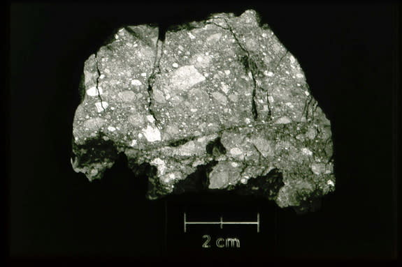 The moon rock shown here is an example of a lunar breccia, a rock that is composed of other rock fragments. Meteorite impacts on the moon are the main source of rock fragmentation on the lunar surface. Image released June 5, 2014.