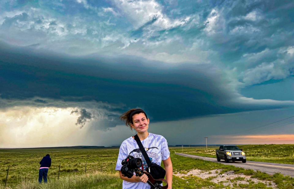 Caitlyn Mims poses for a photo with storms after she left her original tour guide in Colorado.