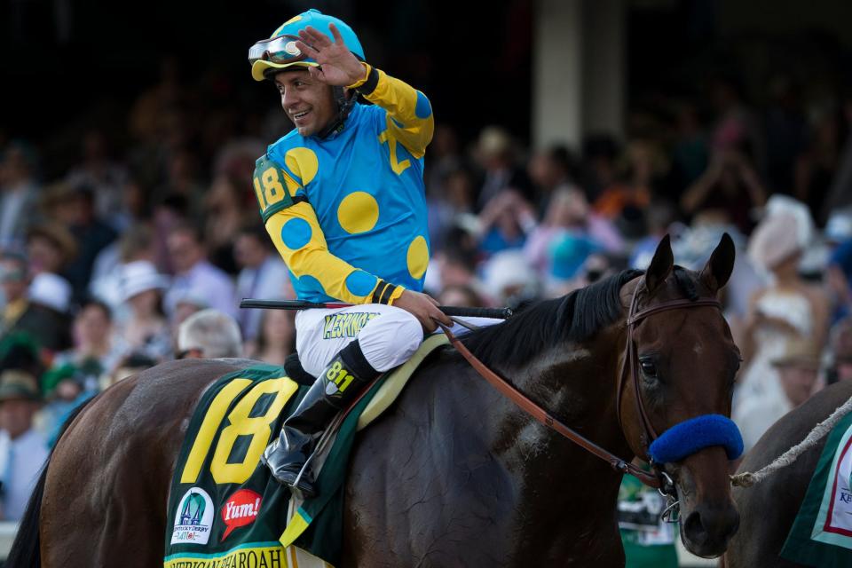 Jockey Victor Espinoza celebrates atop American Pharaoh after winning the 141st Kentucky Derby in 2015.