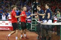 Tennis - Belgium v Great Britain - Davis Cup Final - Flanders Expo, Ghent, Belgium - 28/11/15 Men's Doubles - Great Britain's Andy Murray and Jamie Murray shake hands with Belgium's Steve Darcis and David Goffin after winning their match Action Images via Reuters / Jason Cairnduff Livepic