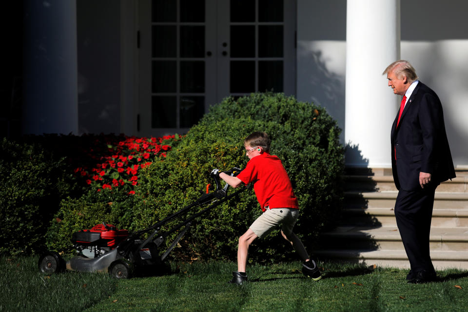 <p>President Donald Trump looks on as 11-years-old Frank Giaccio cuts the Rose Garden grass at the White House in Washington, U.S., September 15, 2017. Frank, who wrote a letter to Trump offering to mow the White House lawn, was invited to work for a day at the White House along the National Park Service staff. (Photo: Carlos Barria/Reuters) </p>