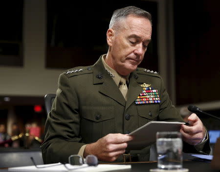 Joint Chiefs of Staff Chairman USMC General Joseph Dunford, Jr. looks at his notes before testifying at a Senate Armed Forces Committee hearing on "United States Strategy in the Middle East" in Washington October 27, 2015. REUTERS/Gary Cameron
