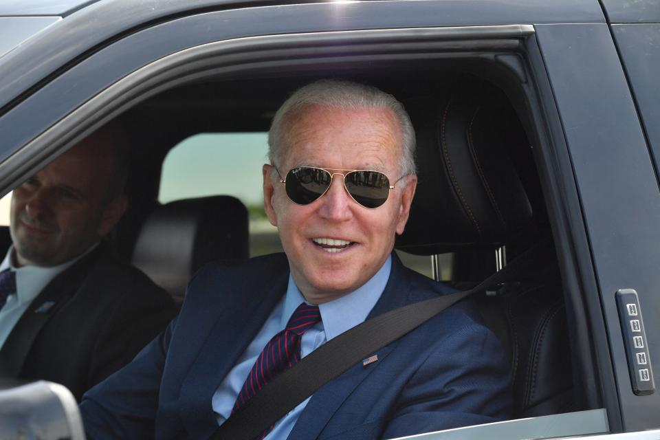 US President Joe Biden talks to the media after driving the new electric Ford F-150 Lightning at the Ford Dearborn Development Center in Dearborn, Michigan on May 18, 2021. (Photo by Nicholas Kamm / AFP) (Photo by NICHOLAS KAMM/AFP via Getty Images)
