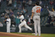 Baltimore Orioles starting pitcher Jorge Lopez watches as Seattle Mariners' Kyle Seager rounds the bases after hitting a solo home run during the fourth inning of a baseball game, Tuesday, May 4, 2021, in Seattle. (AP Photo/Ted S. Warren)