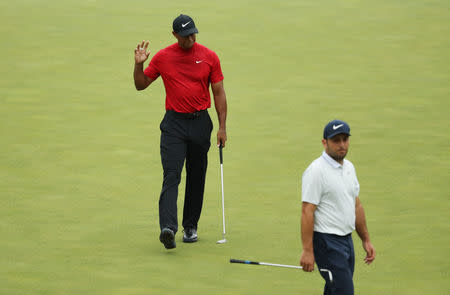 Golf - Masters - Augusta National Golf Club - Augusta, Georgia, U.S. - April 14, 2019. Tiger Woods of the U.S. and Francesco Molinari of Italy on the 15th green during final round play. REUTERS/Lucy Nicholson