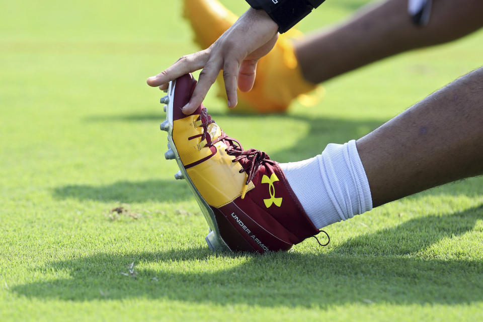 Washington Football Team defensive end Chase Young (99) warms up during NFL football practice in Richmond, Va., Wednesday, July 28, 2021. (AP Photo/Ryan M. Kelly)