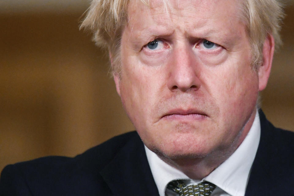 Britain's Prime Minister Boris Johnson looks on during a coronavirus briefing in Downing Street, London, Monday, Oct. 12, 2020. (Toby Melville/Pool Photo via AP)