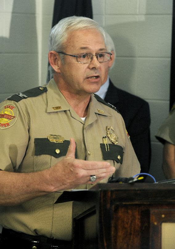 Tennessee Highway Patrol Col. Tracy Trott discusses the results of an investigation into a fatal church bus crash Monday, April, 28, 2014, in Knoxville, Tenn. The investigation concluded a blown tire caused the October 2, 2013, accident in which the bus crossed the Interstate 40 median and crash into an SUV and tractor-trailer, killing eight people and injuring 14. (AP Photo/Knoxville News Sentinel, Michael Patrick)