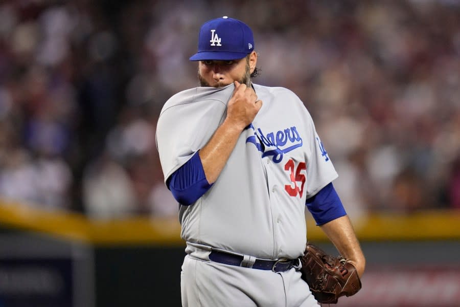 Los Angeles Dodgers starting pitcher Lance Lynn wipes his face with his jersey after giving up three home runs during the third inning in Game 3 of a baseball NL Division Series against the Los Angeles Dodgers, Wednesday, Oct. 11, 2023, in Phoenix. (AP Photo/Ross D. Franklin)