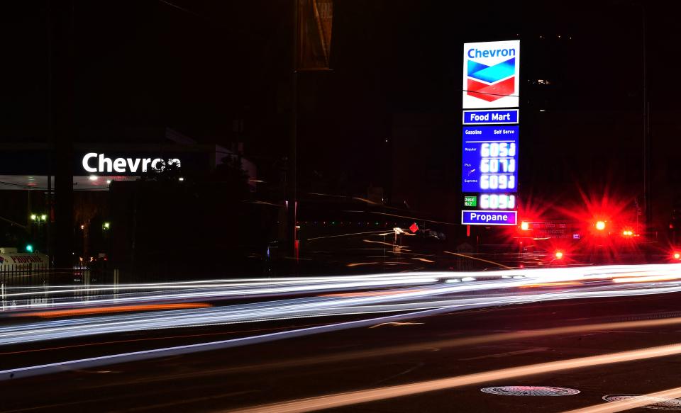 Traffic passes a downtown Los Angeles gas station where a gallon of gas costs over six dollars on December 10, 2021. - Data released on December 10 showed an average rise of 6.8 percent in the price of gas across the United States over last year&#39;s prices, the largest increase since June 1982. (Photo by Frederic J. BROWN / AFP) (Photo by FREDERIC J. BROWN/AFP via Getty Images)