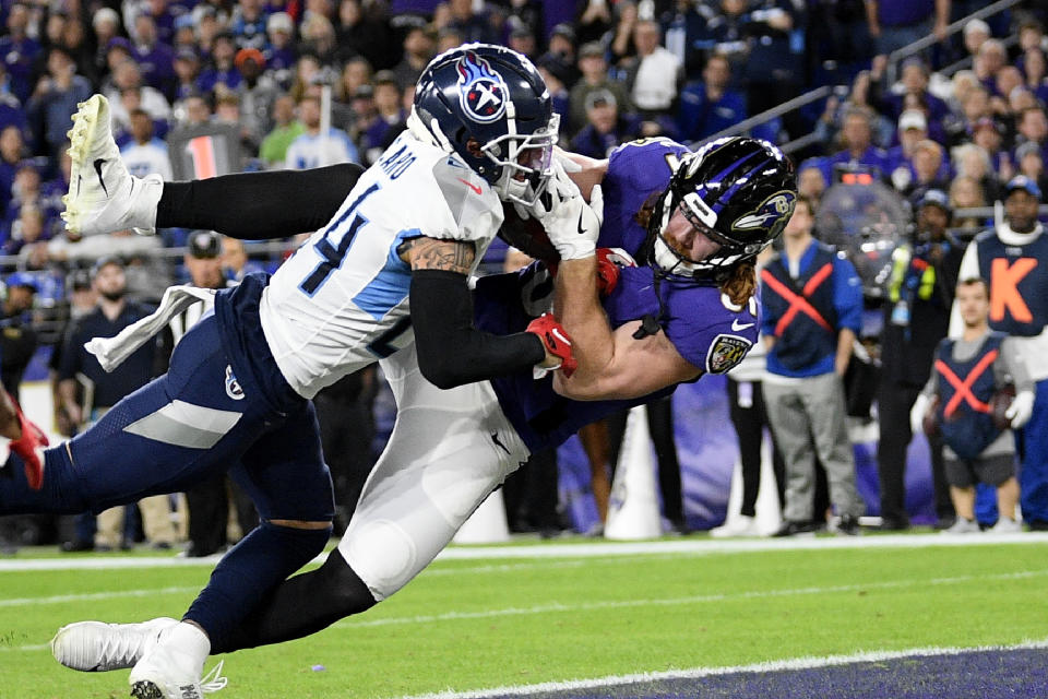 Tennessee Titans strong safety Kenny Vaccaro (24) defends as Baltimore Ravens tight end Hayden Hurst (81) makes a touchdown catch during the second half of an NFL divisional playoff football game, Saturday, Jan. 11, 2020, in Baltimore. (AP Photo/Nick Wass)