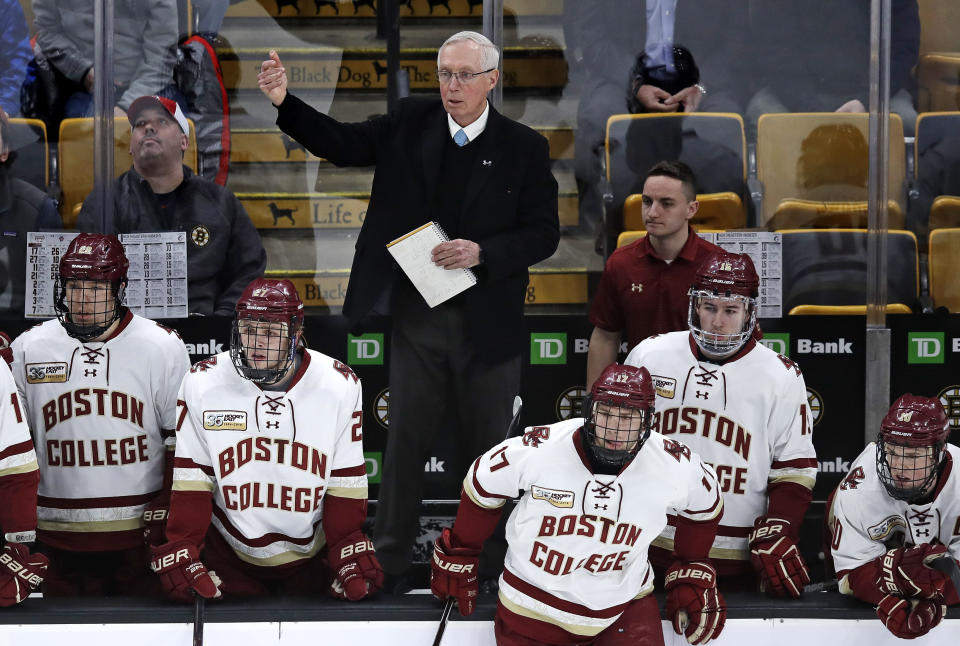 Boston College head coach Jerry York calls to his players during the first period of the NCAA hockey Beanpot tournament championship game against Northeastern in Boston, Monday, Feb. 11, 2019. Boston College announced they signed hockey coach York to a contract extension. The school said on Monday that the five-time NCAA champion received a multi-year deal. York is college hockey's all-time winningest coach with 1,063 career victories. (AP Photo/Charles Krupa)