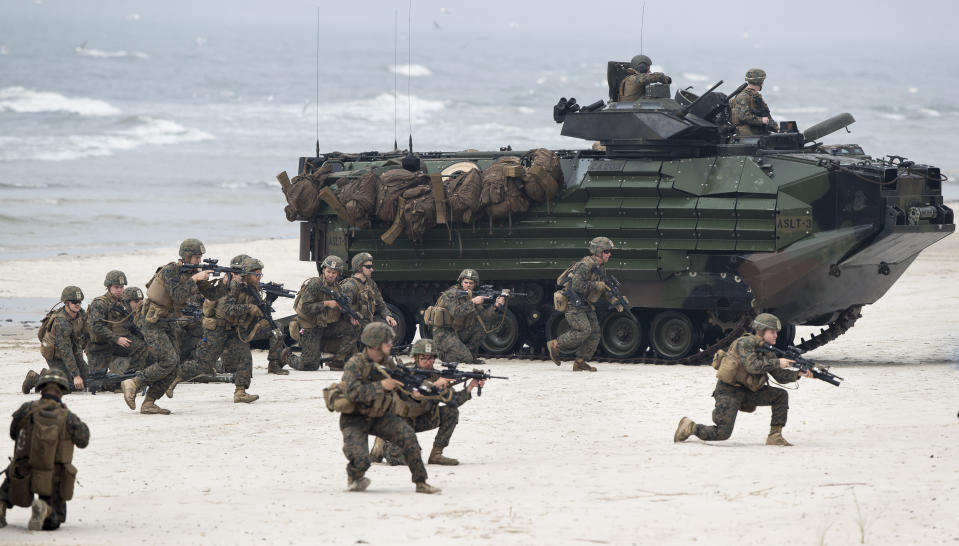 FILE - In this June 4, 2018, file photo, U.S. Marines take a part in a military exercise in the Baltic Sea near the village of Nemirseta, about 340 kilometers (211 miles) northwest of Vilnius, the capital of the former Soviet republic of Lithuania. Ahead of a summit meeting between U.S. President Joe Biden and Russian President Vladimir Putin on June 16, 2021, Moscow has accused the European Union and NATO members that once were part of the Soviet Union or the Warsaw Pact of “Russophobia,” casting them as key instigators of Western sanctions against Russia. (AP Photo/Mindaugas Kulbis, File)