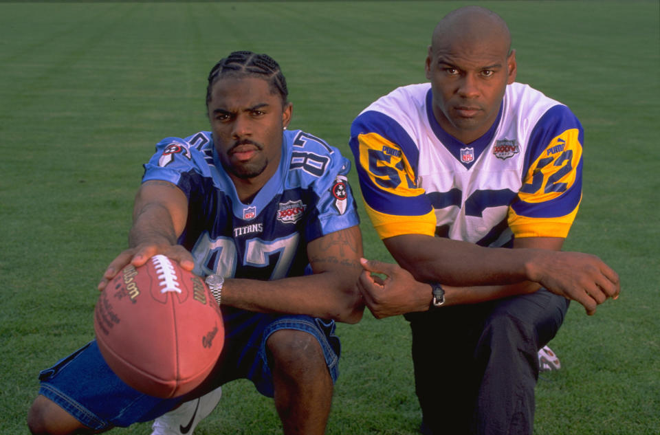 Kevin Dyson, left, and Mike Jones became friends since “The Tackle” ended Super Bowl XXXIV. (Getty Images)