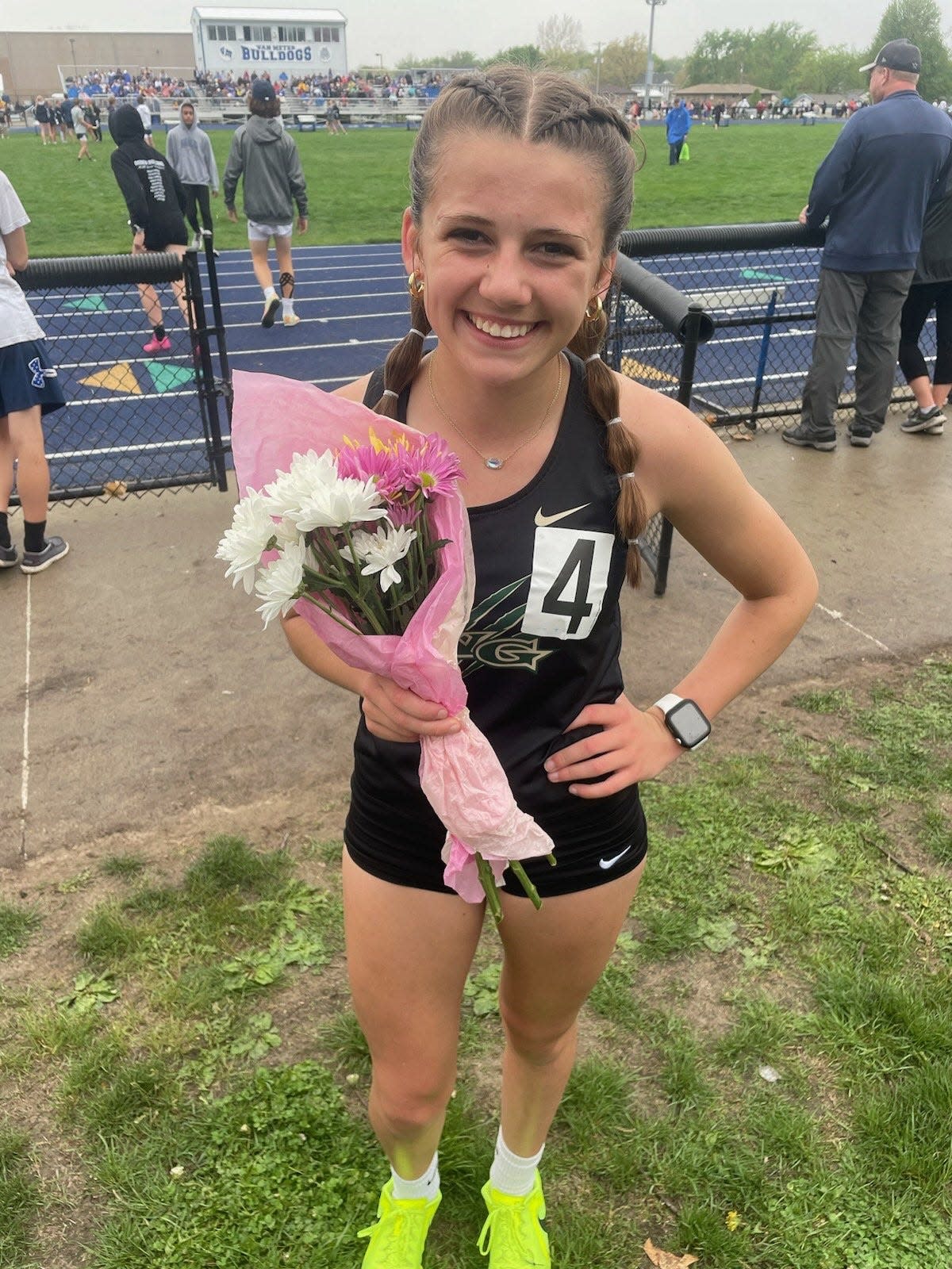 Eva Fleshner poses for a photo after advancing to state in the 1,500 and 3,000-meter runs during the qualifying meet on Thursday, May 11, 2023, in Van Meter.