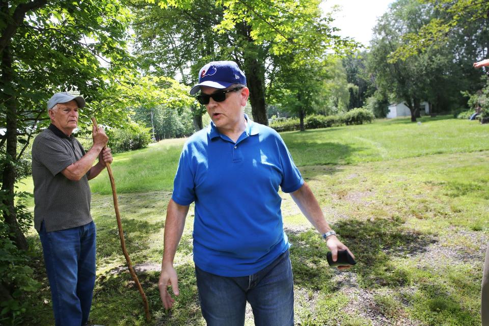 Rochester residents Richard Cook, left, and Ray Wayman are seen Friday, June 30, 2023, at the property line of 753 Salmon Falls Road, where they are raising concerns about plans for a new elementary schooll.