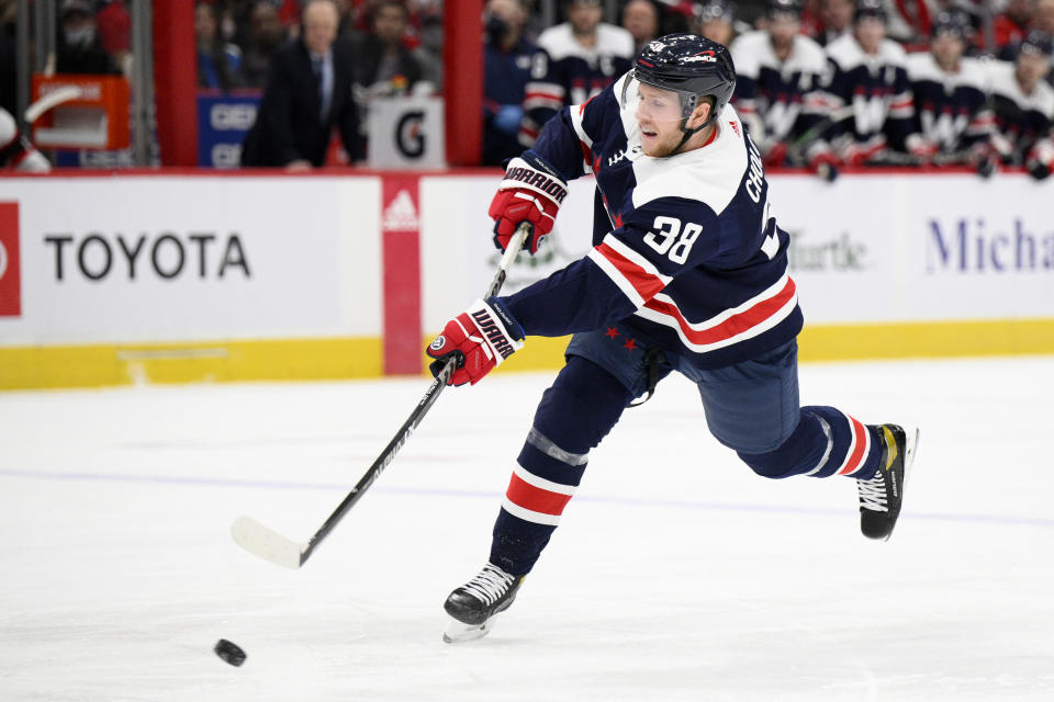 Washington Capitals defenseman Dennis Cholowski (38) shoots during the first period of an NHL hockey game against the Ottawa Senators, Saturday, Jan. 22, 2022, in Washington. (AP Photo/Nick Wass)