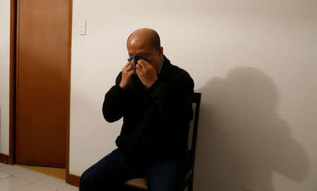 Retired policeman Arturo Lascanas uses a handkerchief to wipe his face during an interview with Reuters at a safehouse in an undisclosed place in Metro Manila, in the Philippines March 9, 2017. REUTERS/Erik De Castro