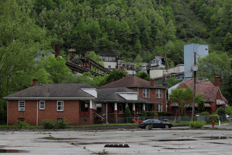 FILE PHOTO: Homes sit in front of an idled coal mine in Keystone, West Virginia