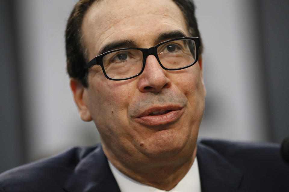 FILE - In this April 9, 2019, file photo, Treasury Secretary Steven Mnuchin testifies before a House Appropriations subcommittee hearing on Capitol Hill in Washington. Mnuchin is asking for more time to respond to House Democrats’ request for President Donald Trump’s tax returns. Mnuchin says in a letter to House Ways and Means Chairman Richard Neal of Massachusetts that he will give the panel a final decision by May 6. The committee had set a deadline for Tuesday, April 23. (AP Photo/Patrick Semansky, File)