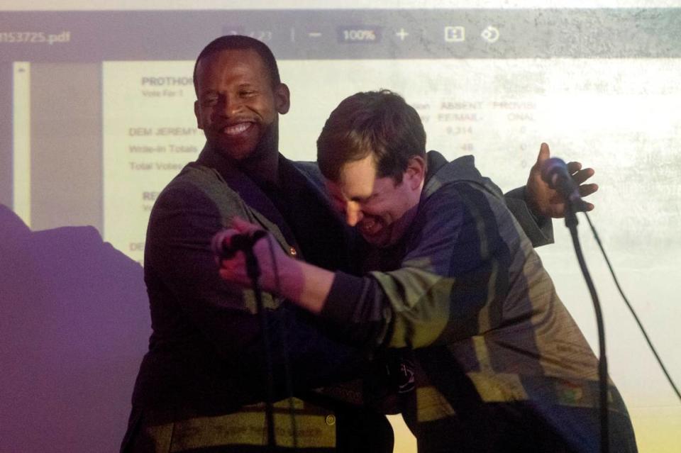 Ferguson Township supervisor candidates Omari Patterson and Jeremie Thompson shake hands and celebrate after thanking supporters at the Centre County Democrats' Election Night party on Tuesday, Nov. 7, 2023 at 3 Dots Downtown.