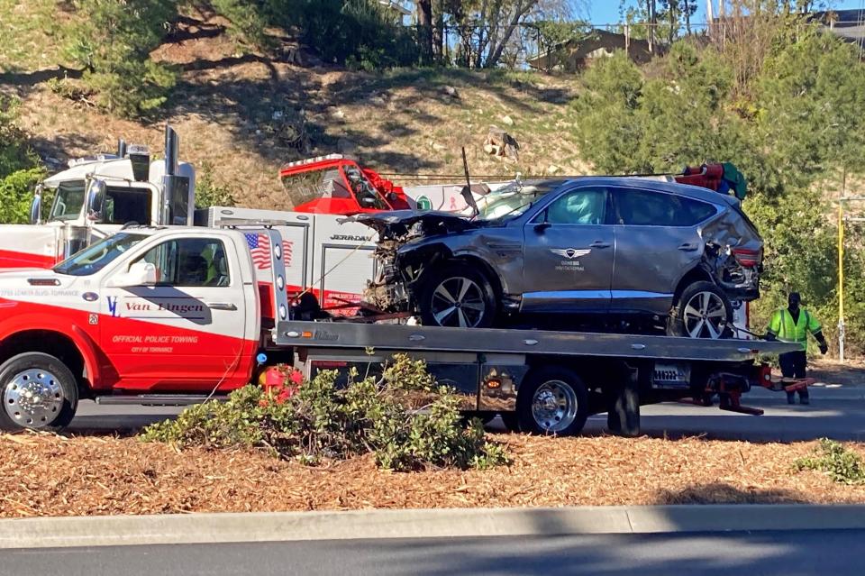 The vehicle driven by Tiger Woods on the back of a truck in Los Angeles after he suffered leg injuries when the vehicle rolled over.PA