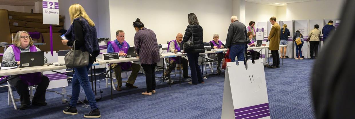 <span class="caption">Australian voters check in and cast their ballots in a September 2019 federal election.</span> <span class="attribution"><a class="link " href="https://www.flickr.com/photos/auselectoralcom/48801171148/" rel="nofollow noopener" target="_blank" data-ylk="slk:Australian Electoral Commission;elm:context_link;itc:0;sec:content-canvas">Australian Electoral Commission</a></span>