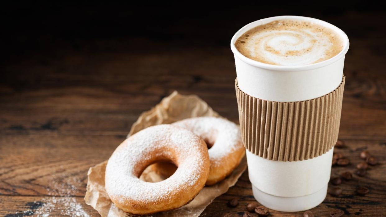 takeaway coffee cup and donuts