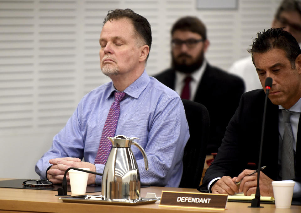 Photo of Merritt reacting to being found guilty of four counts of first-degree murder of the McStay family. 