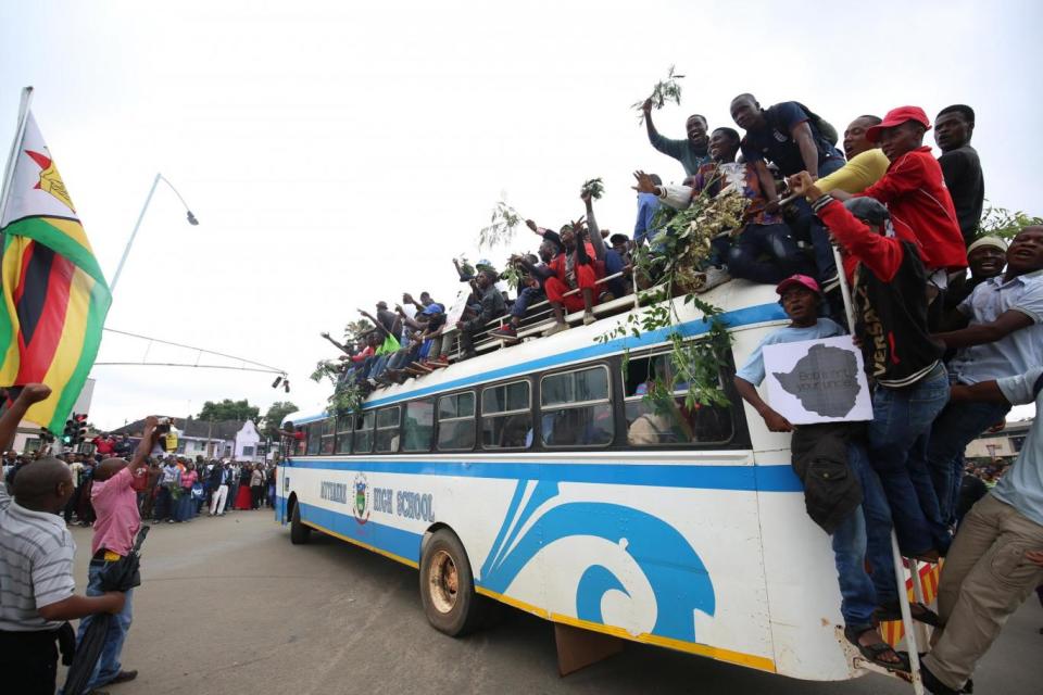 Thousands of protesters lined the streets of Harare (EPA)