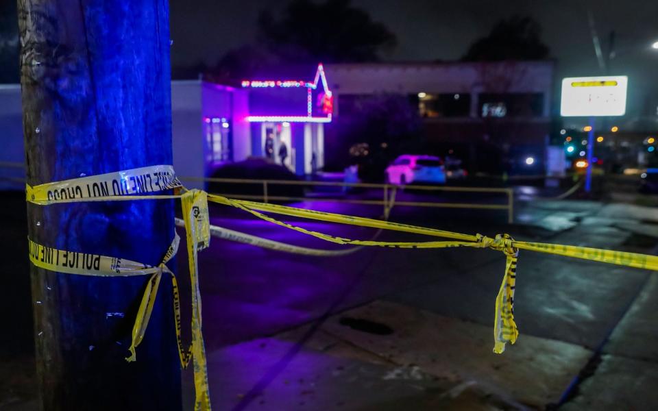 Atlanta Police Department officers investigate the scene of spa shootings on Piedmont Road in Atlanta, Georgia - Erik Lesser/Shutterstock