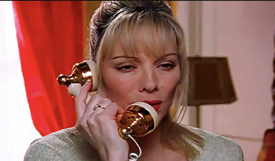 Samantha from "Sex and The City" talking on an old-fashioned corded phone