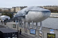 A giant whale sculpture is displayed along the side of the river Seine in Paris, France, December 5, 2015 as the World Climate Change Conference 2015 (COP21) continues at Le Bourget near the French capital. REUTERS/Benoit Tessier