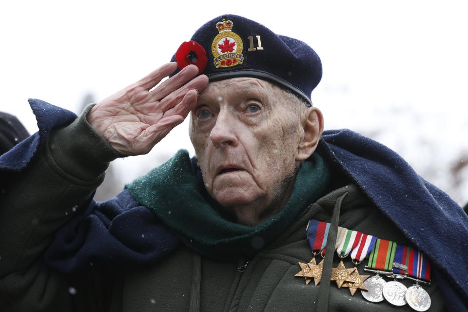 Second World War veteran Bruce Bullock salutes during the Remembrance Day ceremony at the National War Memorial in Ottawa