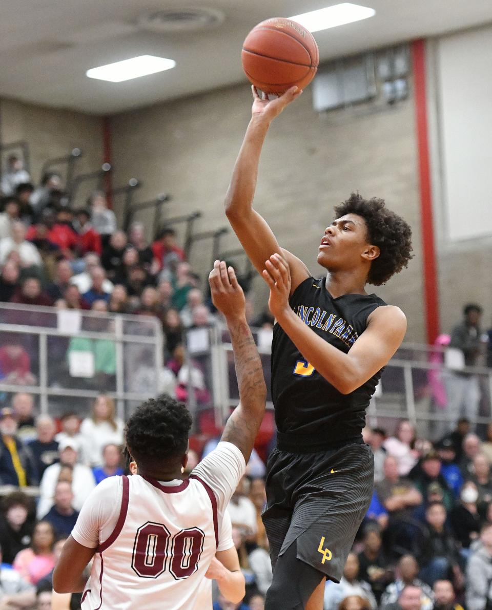 Lincoln Park's Brandin Cummings shoots over Uniontown's Notorious Grooms during Monday's PIAA Class 4A semifinal game at Charleroi High School.