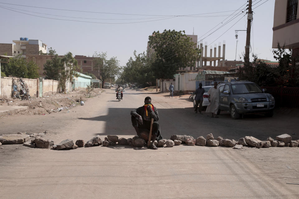 People set up a barricade as part of a civil disobedience campaign following the killing of 7 anti-coup demonstrators in Khartoum, Sudan, Tuesday, Jan.18, 2022. The pro-democracy movement condemned Monday's deadly shootings and called for a two-day civil disobedience campaign over the security forces' actions. (AP Photo)