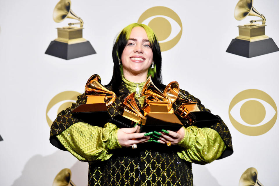 Billie Eilish poses with her Grammy awards (Alberto E. Rodriguez / Getty Images)