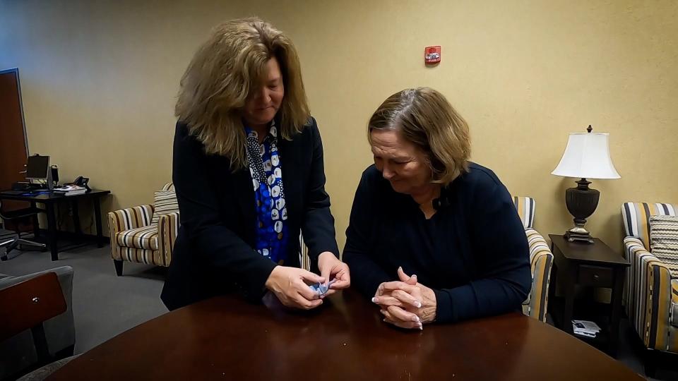 Mary Strand, of Rogers, Minnesota, is reunited with her wedding ring in a video posted May 18, 2023, after she accidentally flushed it down the toilet 13 years ago.