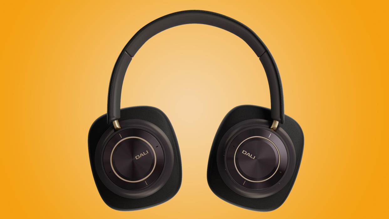  Dali IO-12 headphones against orange background 