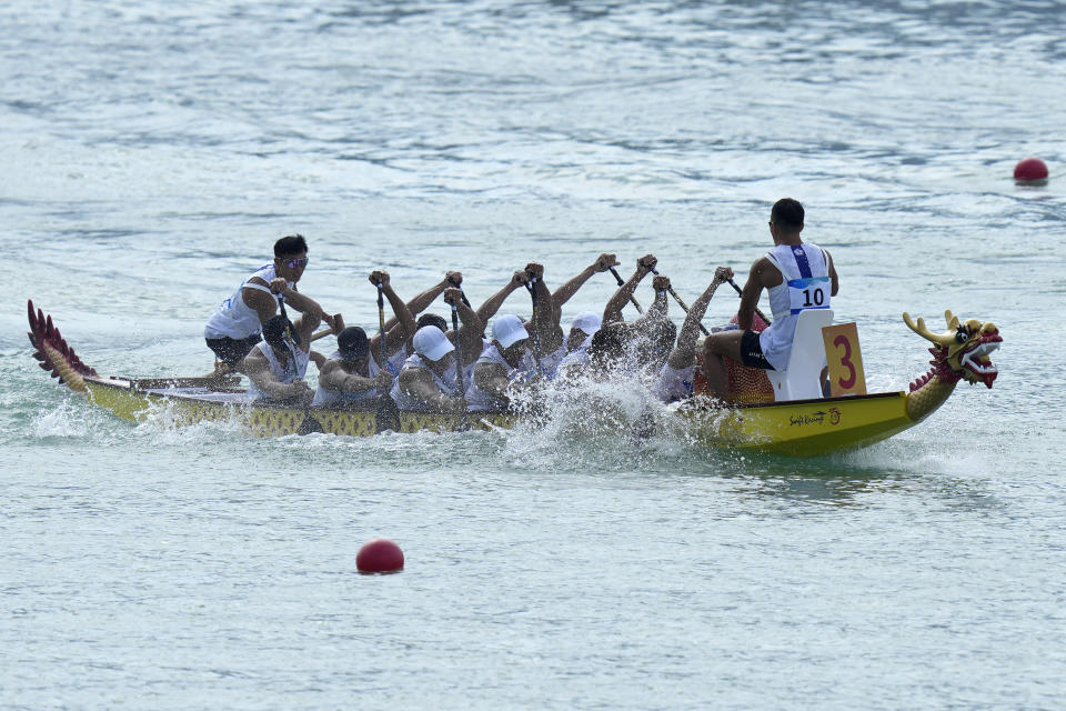 Taiwan's dragon boat team takes part in the Men's Dragon Boat 200m Semi-final during the 19th Asian Games at the Wenzhou Dragon Boat Center in Wenzhou, China, Wednesday, Oct. 4, 2023. (AP Photo/Eugene Hoshiko)