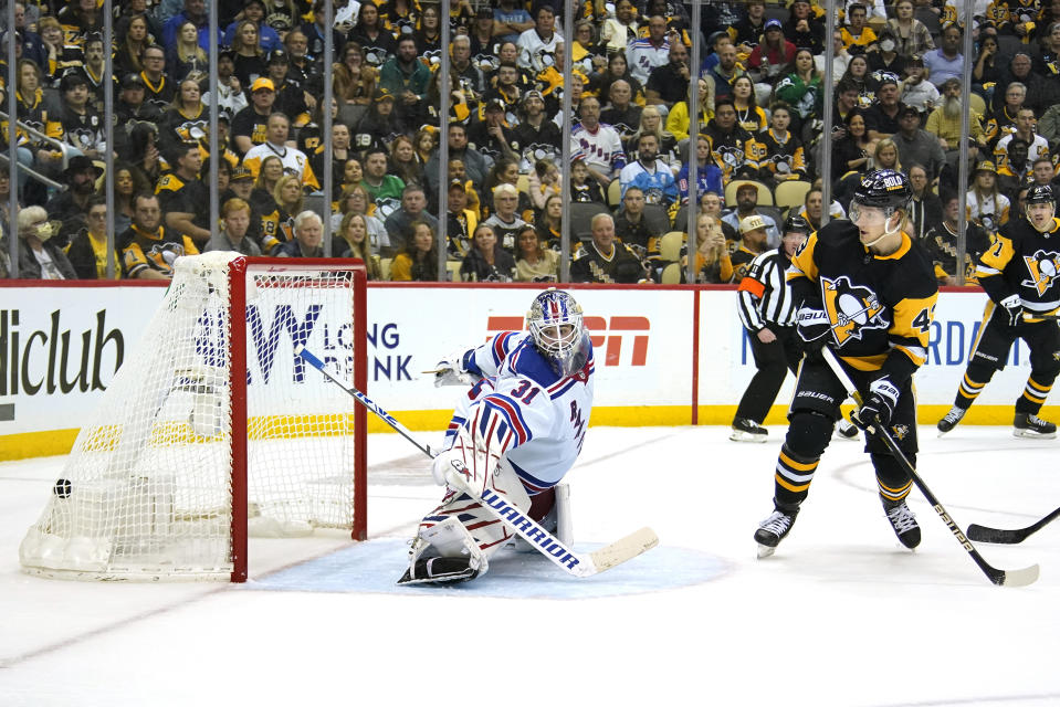 Pittsburgh Penguins' Danton Heinen (43) deflects the puck past New York Rangers goaltender Igor Shesterkin (31) for a goal during the second period in Game 4 of an NHL hockey Stanley Cup first-round playoff series in Pittsburgh, Monday, May 9, 2022. (AP Photo/Gene J. Puskar)