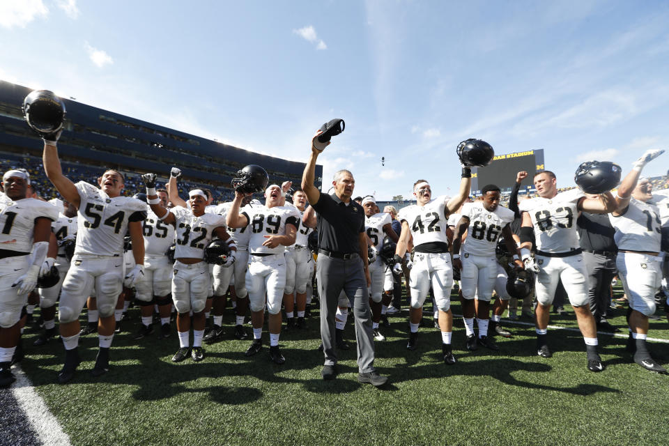 Army head coach Jeff Monken stands with his team singing after an NCAA college football game against Michigan in Ann Arbor, Mich., Saturday, Sept. 7, 2019. Michigan won 24-21 in double-overtime. (AP Photo/Paul Sancya)