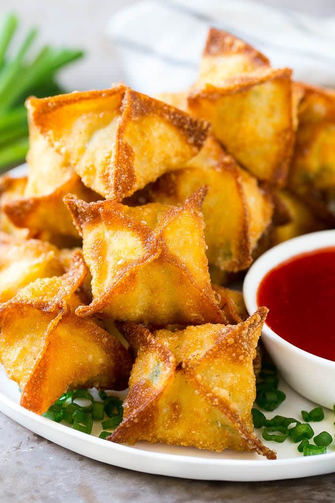 <p>These golden pockets of perfection are stuffed with crab meat and cream cheese, and they look delicious. This recipe will deliver you with restaurant quality crab wontons.</p><p>Get the <a href="https://www.dinneratthezoo.com/crab-rangoon/" rel="nofollow noopener" target="_blank" data-ylk="slk:Crab Rangoon;elm:context_link;itc:0;sec:content-canvas" class="link ">Crab Rangoon</a> recipe.</p><p>Recipe from <a href="https://www.dinneratthezoo.com/" rel="nofollow noopener" target="_blank" data-ylk="slk:Dinner At The Zoo;elm:context_link;itc:0;sec:content-canvas" class="link ">Dinner At The Zoo</a>.</p>