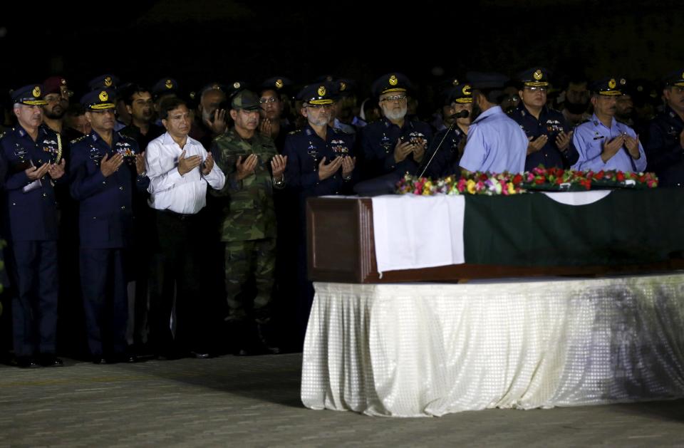 Air Chief Marshal Sohail Aman and senior officials of the Pakistan Air Force (PAF) pray during the funeral of flying officer Marium Mukhtiar at the PAF Base Faisal in Karachi