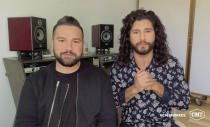 In this video image provided by CMT, Shay Mooney, left, and Dan Smyers, of Dan + Shay, accept the duo video of the year for “I Should Probably Go To Bed” during the Country Music Television awards airing on Wednesday, Oct. 21, 2020. (CMT via AP)