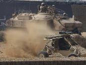 <p><span>Members of the United Arab Emirates' armed forces take part in a military show launching the International Defence Exhibition and Conference (IDEX) at the Abu Dhabi National Exhibition Centre in the Emirati capital on February 17, 2013. </span></p>