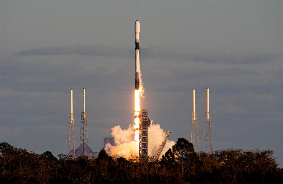 Another Falcon 9, this one launched from the Cape Canaveral Space Force Station, boosted six missile detection and tracking satellites into orbit for the U.S. Space Force in a prelude to the early Thursday moonshot. / Credit: William Harwood/CBS News
