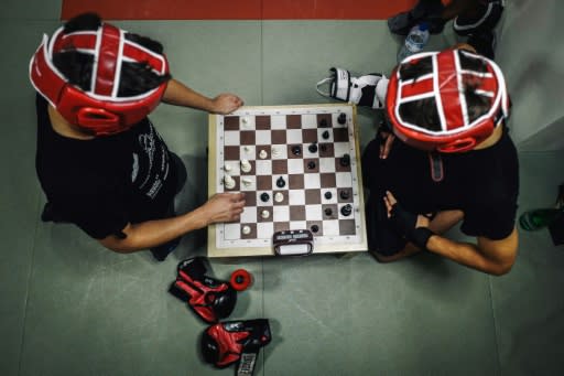 Chessboxers play six rounds of chess and five rounds of boxing during a bout